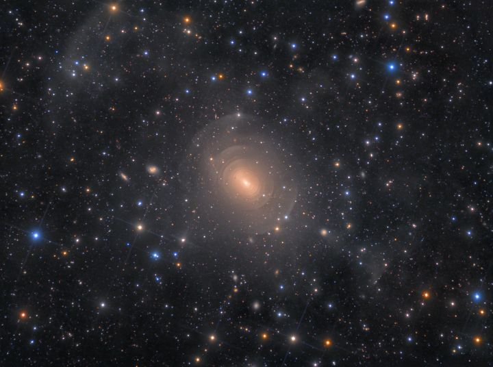 Shells of Elliptical Galaxy NGC 3923 in Hydra, Rolf Wahl Olsen.This is a deep image of the peculiar, elliptical galaxy NGC 3923. The galaxy features myriad concentric shells as a result of past mergers with other nearby galaxies. A prominent stream of stars extends towards the lower right, terminating abruptly in a shell-like fragment.