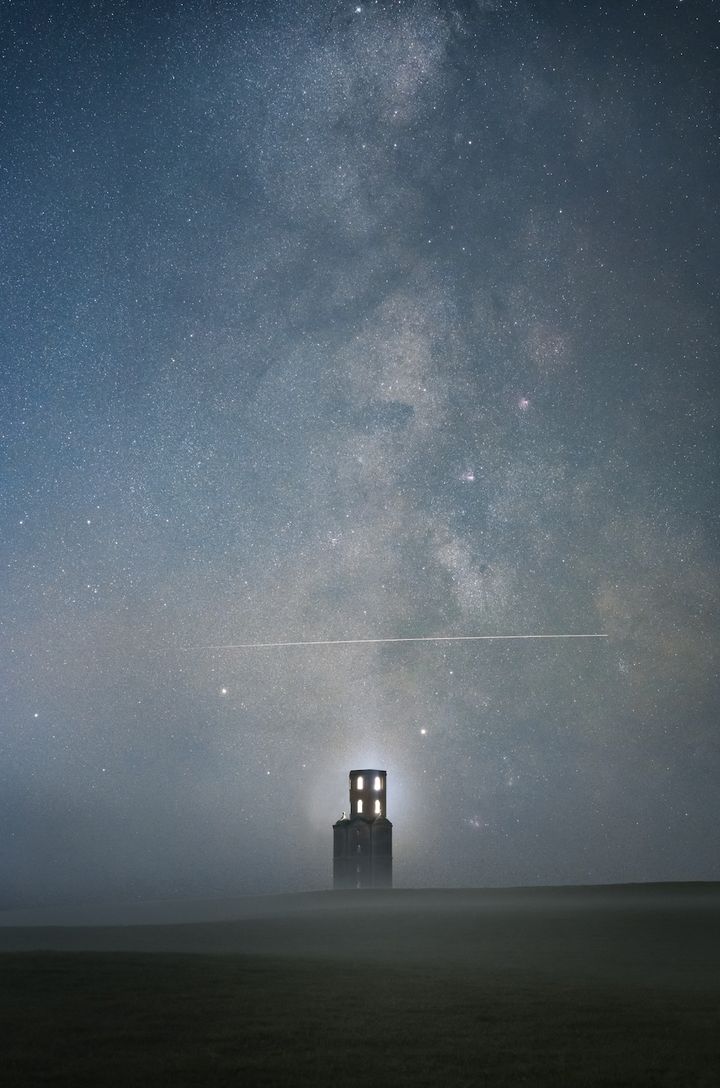 Above the Tower, Sam King.The International Space Station (ISS) is flying over Horton Tower in Dorset on a misty evening. The tower is believed to have been built with the intention of being used as an observatory. During the two exposures shot for the sky, the photographer was able to perfectly capture the ISS fly directly over the tower. Although the mist didn't help with capturing the finer details of the core, it did add mystery to the final image, as did the tower’s lights. 