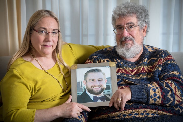 Mary and Joel Rich hold a photo of their son in their Omaha, Nebraska, home on Jan. 11, 2017. Seth Rich, a Democratic Nationa
