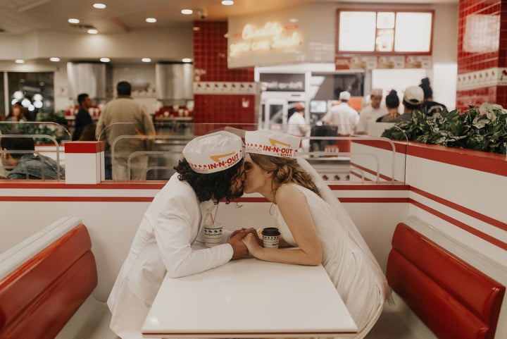 The couple stole a kiss before their order was up. 