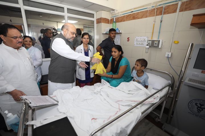 Union Home Minister Amit Shah distributing sweets and fruits to AIIMS patients on Saturday morning. 
