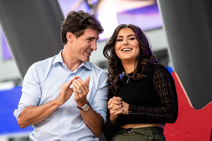 Liberal leader Justin Trudeau speaks with Bianca Andreescu on stage during a rally for her in Mississauga, Ont. on Sept. 15, 2019.