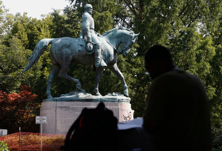 The statue of Confederate general Robert E. Lee stands in downtown Charlottesville, Virginia. 