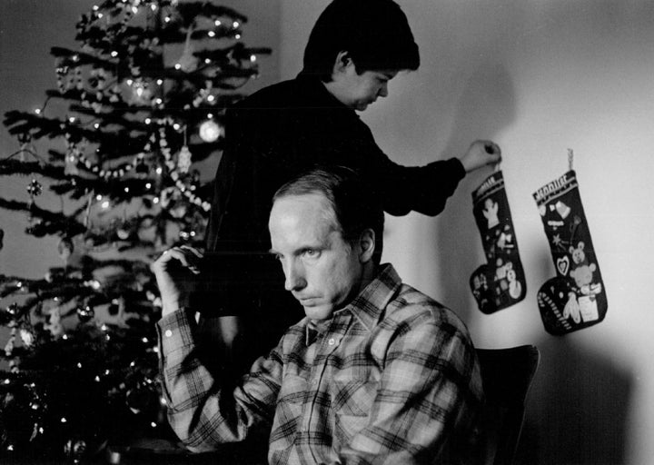 Jonelle's mother hangs her Christmas stocking in their home in Greeley, Colorado on December 24, 1984. The child was rep