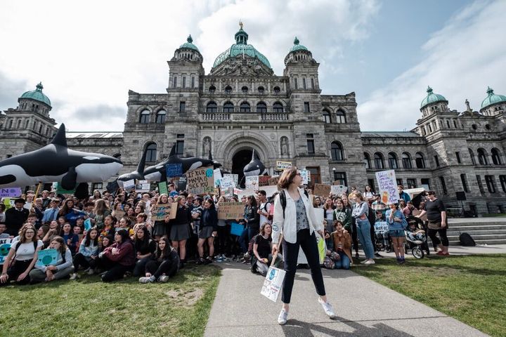 Emma-Jane Burian, 17, stands outside the B.C. legislative buildings in Victoria during a climate strike on May 3, 2019. She is one of the organizers with Climate Strike Canada.
