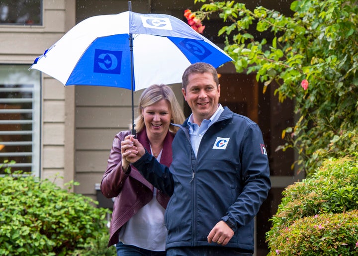 Conservative Leader Andrew Scheer and his wife Jill leave a campaign announcement in Surrey, B.C., Sept. 15, 2019.