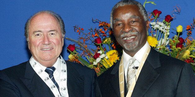 South African President Thabo Mbeki, right, shakes hands with FIFA President Sepp Blatter, left, at Union...