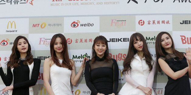 South Korean K-Pop group EXID poses for photographers prior to the K-Pop Awards 2014 in Seoul, South...