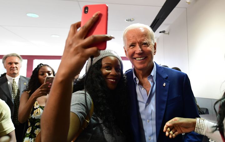 Democratic 2020 presidential hopeful former Vice President Joe Biden poses for selfies while visiting with students at Texas Southern University Student Life Center in Houston, Texas on Sept. 13, 2019. 