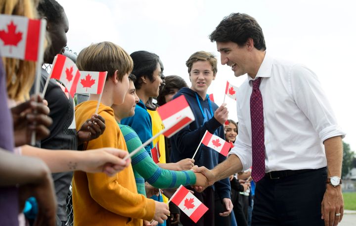 Prime Minister Justin Trudeau greets grade seven and eight students as he makes a campaign stop at Blessed Sacrament Catholic Elementary School in London, Ont., Sept. 16, 2019. 