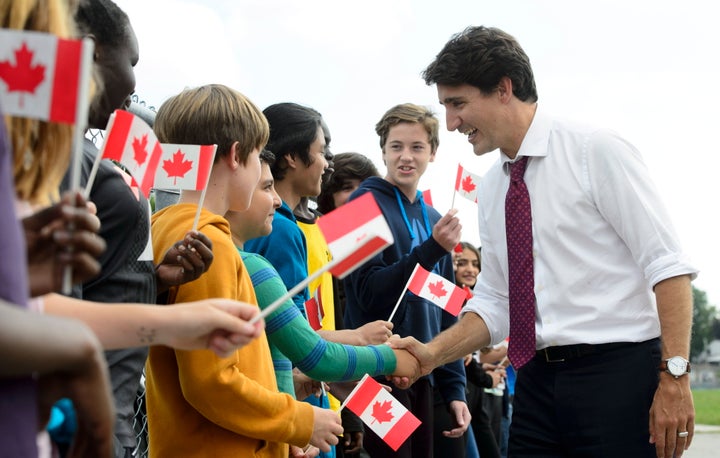 Prime Minister Justin Trudeau greets grade seven and eight students as he makes a campaign stop at Blessed Sacrament Catholic Elementary School in London, Ont., Sept. 16, 2019.
