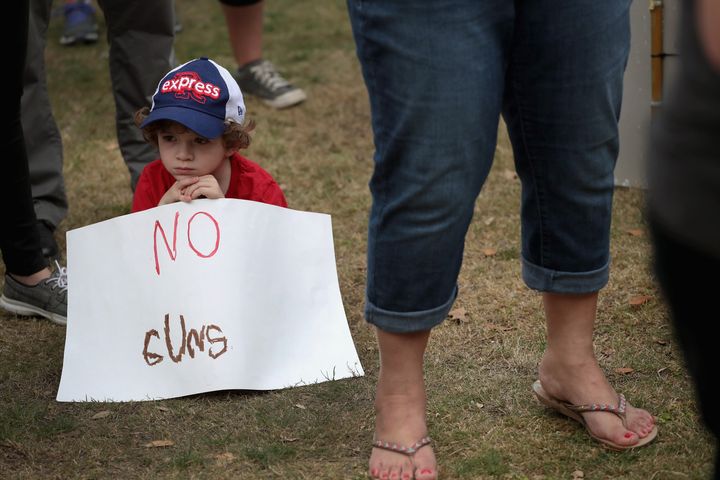=Ryan Price, 6, participates in a March for Our Lives rally on March 24, 2018 in Round Rock, Texas. More than 800 March for Our Lives events, organized by survivors of the Parkland, Florida school shooting.