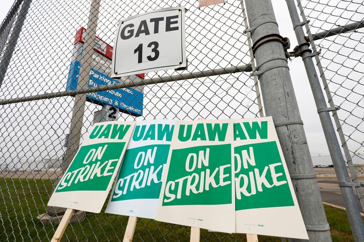 United Auto Workers strike signs are shown at a gate at the General Motors Flint Assembly Plant in Michigan after the UAW declared a national strike after midnight Monday.