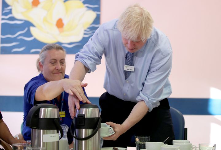 Prime Minister Boris Johnson meets members of staff during a visit to Whipps Cross University Hospital in Leytonstone, east London.