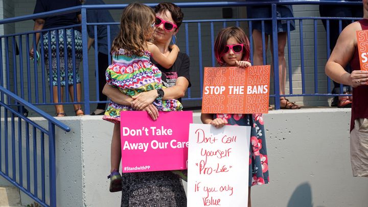 Abortion rights advocates attend a rally after a judge granted a temporary restraining order on the closing of Missouri's sol