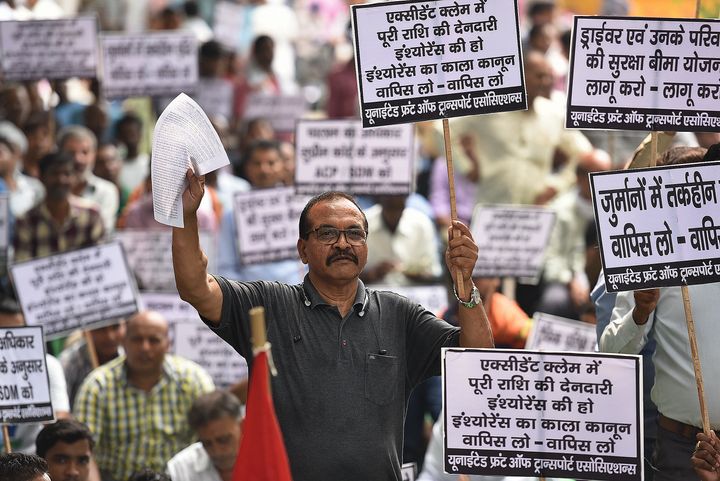 Members from different transport associations protest against the state and central government's new amendments in Motor Vehicle Act 2019, at Jantar Mantar on September 16, 2019 in New Delhi.