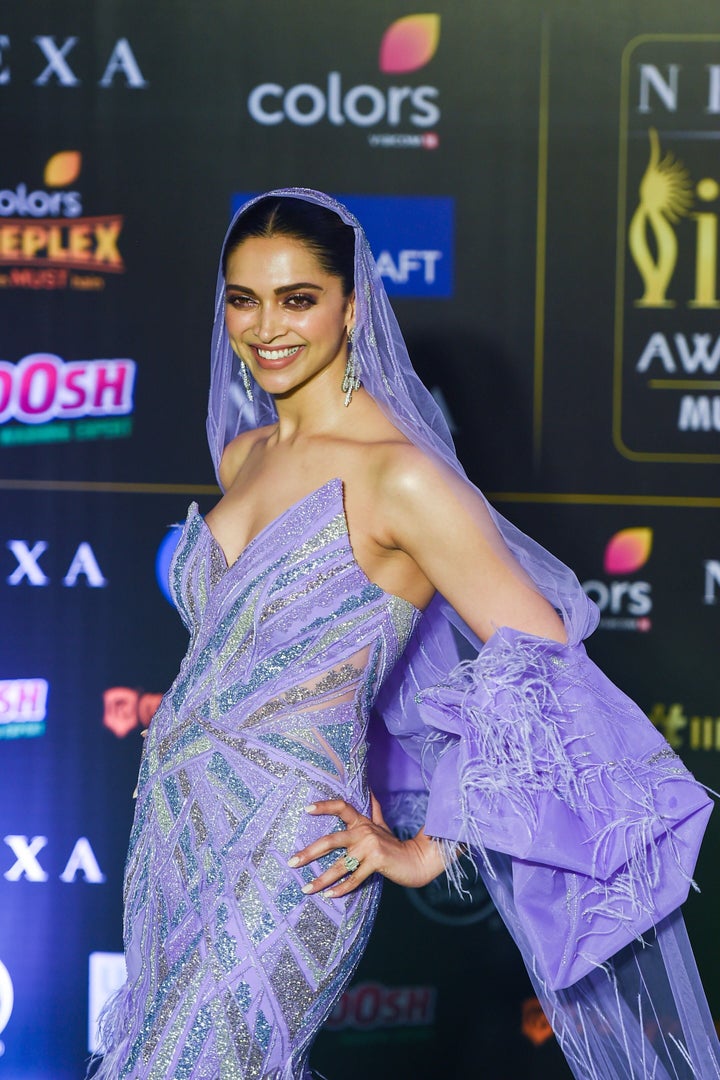 Deepika Padukone in custom purple gown and veil by Gaurav Gupta at the 20th International Indian Film Academy (IIFA) Awards in Mumbai. Padukaone won the Special 20 Award for Chennai Express.