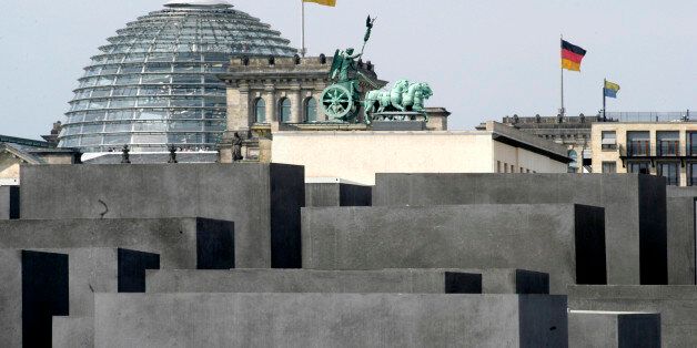 (GERMANY OUT) Germany Berlin Mitte - Holocaust cenotaph, in the background the Brandenburg Gate and the Reichstag building (Photo by ZÃ¶llner/ullstein bild via Getty Images)
