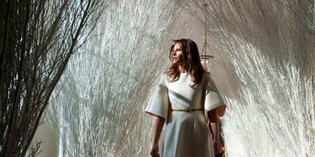 US First Lady Melania Trump walks through Christmas decorations in the East Wing as she tours holiday decorations at the White House in Washington, DC, on November 27, 2017. / AFP PHOTO / SAUL LOEB (Photo credit should read SAUL LOEB/AFP/Getty Images)