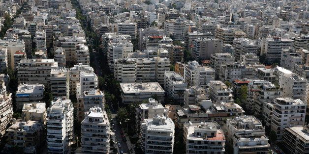 Residential apartment blocks stand on the city skyline in Athens, Greece, on Thursday, June 25, 2015. Greece could tap euro-area funds of as much as 3.35 billion euros ($3.75 billion) by early July if it can reach a deal with its creditors, thanks to profit-sharing pledges from member nations' central banks. Photographer: Simon Dawson/Bloomberg via Getty Images