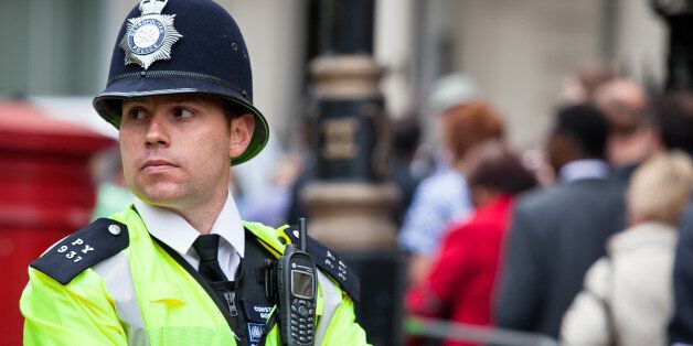 London, UK - April 29, 2011: London Metropolitan Police Officer in Central London keeping the streets safe during the celebration of the Royal Wedding between Prince William, Duke of Cambridge and Catherine Middleton, Duchess of Cambridge.