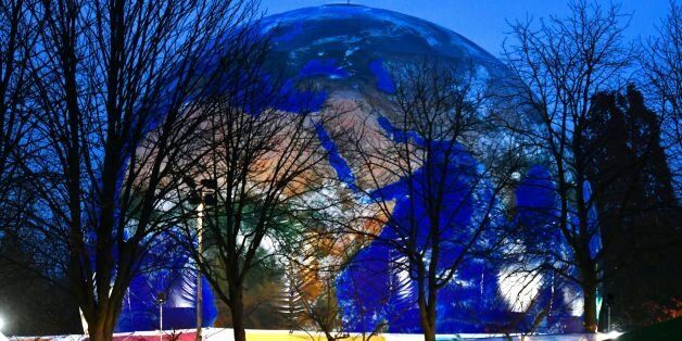A mockup of a planet earth is displayed at the Rheinaue park during the COP23 United Nations Climate Change Conference in Bonn, Germany. / AFP PHOTO / PATRIK STOLLARZ (Photo credit should read PATRIK STOLLARZ/AFP/Getty Images)