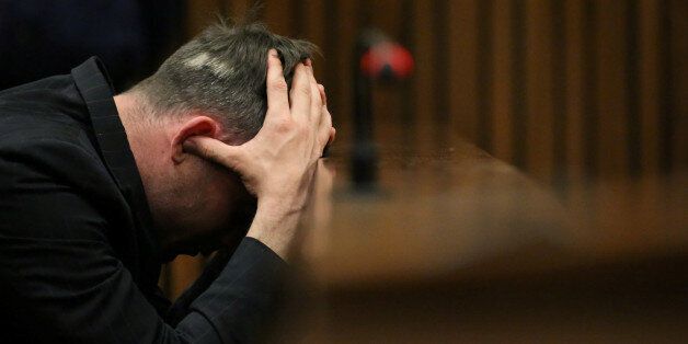 FILE PHOTO Paralympic gold medalist Oscar Pistorius reacts during the third day of the re-sentencing hearing for the 2013 murder of his girlfriend Reeva Steenkamp, at Pretoria High Court, South Africa June 15, 2016. REUTERS/Siphiwe Sibeko/File Photo