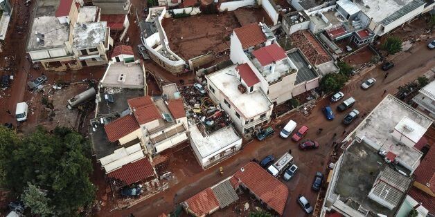 A drone picture taken on November 16, 2017 shows damage and mud covered streets in the town of Mandra, after a flash flood caused damages and killed 16 people. / AFP PHOTO / LEFTERIS PARTSALIS (Photo credit should read LEFTERIS PARTSALIS/AFP/Getty Images)