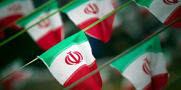 FILE PHOTO: Iran's national flags are seen on a square in Tehran February 10, 2012, a day before the anniversary of the Islamic Revolution. REUTERS/Morteza Nikoubazl/File Photo