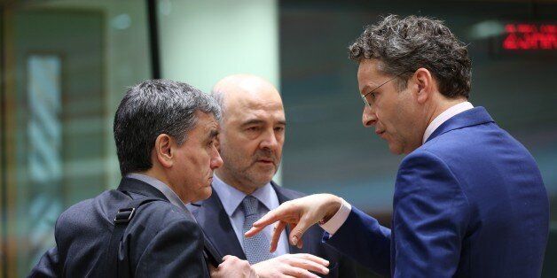 BRUSSELS, BELGIUM - MARCH 20: Dutch Finance Minister and President of the Eurogroup, Jeroen Dijsselbloem (R) and Greek Minister of Finance, Euclid Tsakalotos (L) attends the Euro Zone Finance Ministers Meeting in Brussels, Belgium on March 20, 2017. (Photo by Dursun Aydemir/Anadolu Agency/Getty Images)