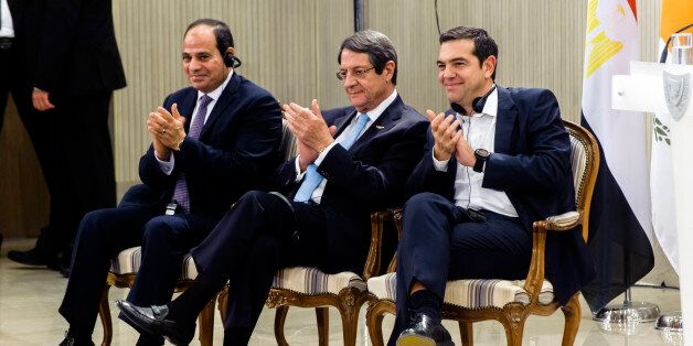 Cypriot President Nicos Anastasiades (C), Greek prime minister Alexis Tsipras and Egyptian President Abdel Fattah al-Sisi (L) clap their hands during a press conference at the presidential palace in Nicosia on November 21, 2017. / AFP PHOTO / Iakovos Hatzistavrou (Photo credit should read IAKOVOS HATZISTAVROU/AFP/Getty Images)