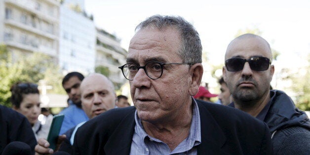 Greek Migration Minister Yannis Mouzalas talks to the media at central Athens's Victoria Square, where many refugees and migrants had set up following their arrival in Athens, Greece, October 1, 2015. The European Union must stop countries picking and choosing which refugees they accept in its relocation programme, otherwise it will turn into a shameful