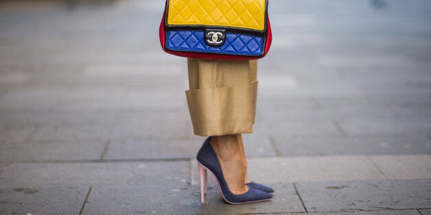 BARCELONA, SPAIN - NOVEMBER 27: Alexandra Lapp wearing wide cut khaki pants from Steffen Schraut, khaki jacket with blue collar and blue and white strips on the bottom of the sleeve from Steffen Schraut, denim shirt by Steffen Schraut, So Kate Pumps from Christian Louboutin in denim, Chanel 2.55 bag in red, blue and yellow with golden logo buckle on November 27, 2017 in Barcelona, Spain. (Photo by Christian Vierig/Getty Images)