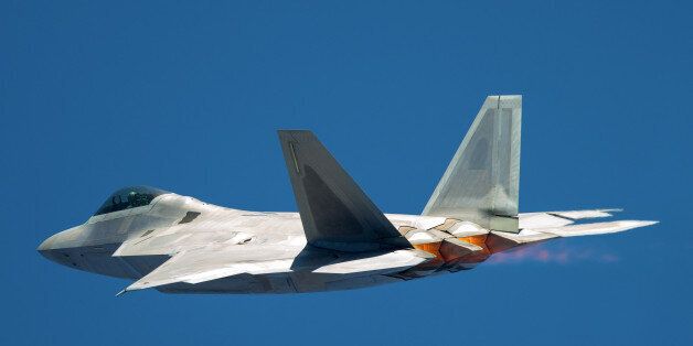 F-22 Raptor in a very unusual close view, with afterburners on