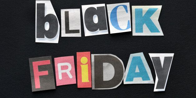 Closeup of newsprint letters spelling out Black Friday on a black background.