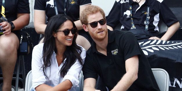 Britain's Prince Harry (R) sits with girlfriend actress Meghan Markle to watch a wheelchair tennis event during the Invictus Games in Toronto, Ontario, Canada September 25, 2017. REUTERS/Mark Blinch