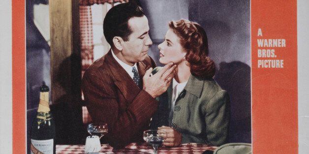 Actors Humphrey Bogart and Ingrid Bergman fall in love on a poster for the Warner Bros. film 'Casablanca', 1942. (Photo by Movie Poster Image Art/Getty Images)