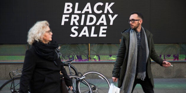 Shoppers on Oxford Street in central London with a sign advertising Black Friday in a shop window on 25th November 2017 in London, England, United Kingdom. This is the busiest shopping district in the capital with Oxford Street being Europe's busiest shopping area. (photo by Mike Kemp/In Pictures via Getty Images)