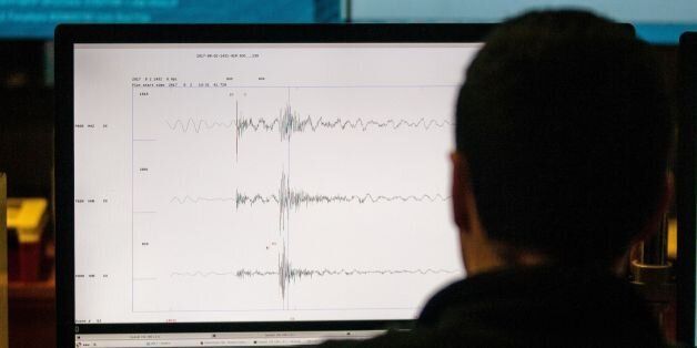 A technician of the National Seismological Center (CSN) of the University of Chile, organization in charge of monitoring the seismic activity in the Chilean territory, works in Santiago, August 4, 2017.Chile has put the San Ramon geological fault capable of destroying the eastern zone of Santiago- under vigilance to try to figure out how this potentially elevated seismic source behaves. / AFP PHOTO / CHRISTIAN MIRANDA / TO GO WITH AFP STORY BY GIOVANNA FLEITAS (Photo credit should read CHRISTIAN MIRANDA/AFP/Getty Images)