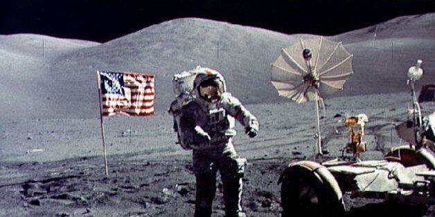 - FILE PHOTO DECEMBER 1972 - Twenty-five years ago tomorrow, on December 19, 1972, humans returned from another celestial body for the last time following the last Apollo mission. In this file photo, astronaut Eugene Cernan walks toward the Lunar Roving Vehicle (LRV) near the U.S. flag at the Taurus-Littrow landing site of Apollo 17. The photograph was taken by astronaut Harrison H. Schmitt, lunar module pilot. Cernan was the last human being to step on the moon as he was entered the Lunar Module after Schmitt for the return flight to earth. ? QUALITY DOCUMENT