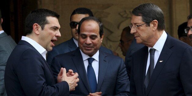 Egyptian President Abdel Fattah al-Sisi (C), Cypriot President Nicos Anastasiades (R) and Greek Prime Minister Alexis Tsipras chat outside the Presidential Palace in Nicosia, April 29, 2015. Greece will launch consultations with Egypt and Cyprus to establish maritime boundaries in the eastern Mediterranean, Tsipras said on Wednesday. REUTERS/Yiannis Kourtoglou