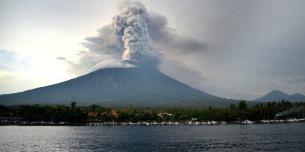 A general view shows Mount Agung erupting seen from Kubu sub-district in Karangasem Regency on Indonesia's resort island of Bali on November 28, 2017. Indonesian authorities extended the closure of the international airport on the resort island of Bali for a second day over fears of a volcanic eruption. / AFP PHOTO / SONNY TUMBELAKA (Photo credit should read SONNY TUMBELAKA/AFP/Getty Images)