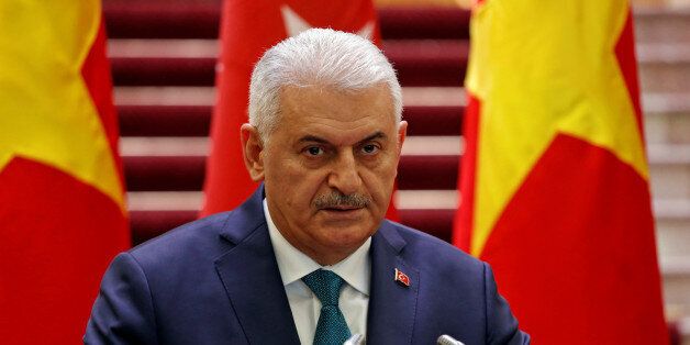 Turkish Prime Minister Binali Yildirim attends a press briefing with his Vietnamese counterpart Nguyen Xuan Phuc (not pictured) at the Government Office in Hanoi, Vietnam August 23, 2017. REUTERS/Kham