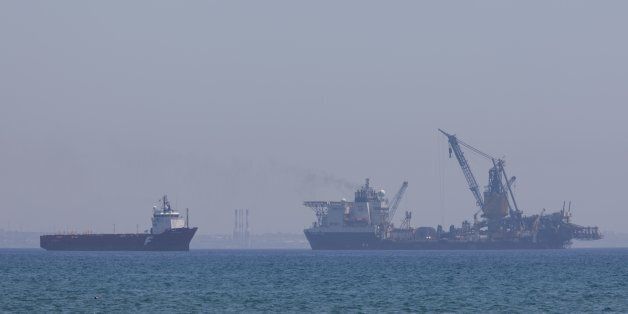 LARNACA, CYPRUS - JULY 12: The Field Development Ship Saipem FDS in Larnaca port on July 12, 2017 in Larnaca, Cyprus.Eni has awarded Saipem a contract for the drilling of two wells offshore Cyprus. Work will once again be carried out by the Saipem 12000 and commence in the fourth quarter of 2017. Saipem was founded in 1957 as a service provider for the Eni group, through the merger of Snam Montaggi and a drilling contractor SAIP. In 1960s it started providing services outside the Eni group, and in 1969 it started operating autonomously. (Photo by Athanasios Gioumpasis/Getty Images)