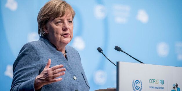 BONN, GERMANY - NOVEMBER 15: German Chancellor Angela Merkel speaks during the COP 23 United Nations Climate Change Conference on November 15, 2017 in Bonn, Germany. The conference, which ends on November 17, has brought together 25,000 participants to discuss climate change-related issues and the progress signatory members are making towards fulfilling CO2 and other pollutants reductions. Many signatories of the Paris Agreement are failing to fulfill their commitments towards combating the global temperature rise. Recent data shows that global CO2 levels are again rising after having stagnated the last couple of years. (Photo by Anthony Kwan/Getty Images)