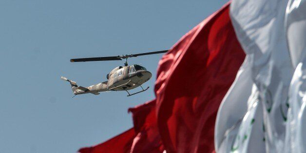 TEHRAN, IRAN - APRIL 18: A military helicopter stages a fly-past during a military parade to mark the National Army Day, in Tehran, Iran on April 18, 2017. (Photo by Fatemeh Bahrami/Anadolu Agency/Getty Images)