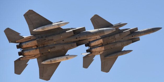 Saudi Air Force advanced F-15SA fighter jets perform during a ceremony marking the 50th anniversary of the creation of the King Faisal Air Academy at King Salman airbase in Riyadh on January 25, 2017. / AFP / FAYEZ NURELDINE (Photo credit should read FAYEZ NURELDINE/AFP/Getty Images)
