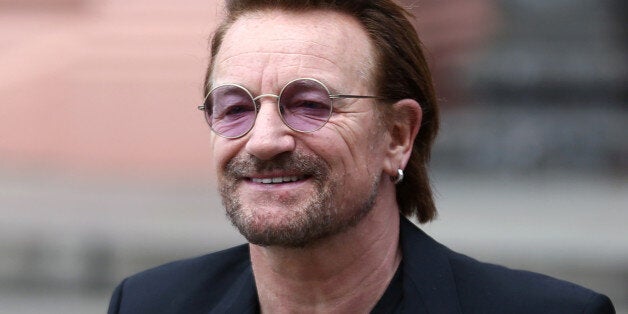 Singer Bono of Irish band U2 looks at fans as he walks out of the Casa Rosada Presidential Palace after a meeting with Argentina's President Mauricio Macri in Buenos Aires, Argentina October 9, 2017. REUTERS/Marcos Brindicci