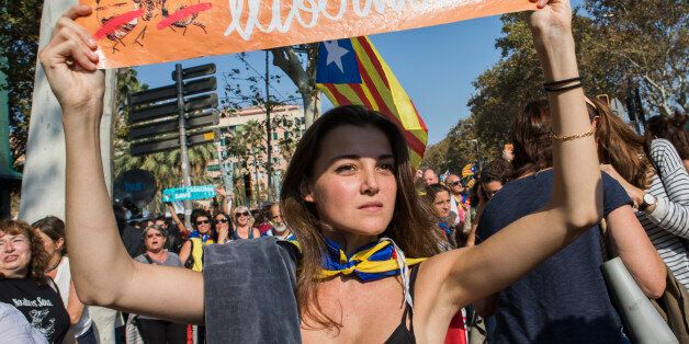 Thousands of Catalan independence supporters have marched in center city and massed outside the Parliament of Catalonia waiting for the votes to declare independence from Spain in Barcelona, Spain, on 27 October 2017. (Photo by Mauro Ujetto/NurPhoto via Getty Images)