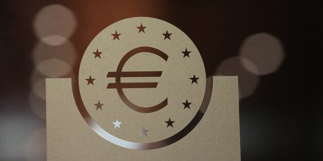 A euro currency symbol sits on a glass panel during the European Central Bank (ECB) Forum On Banking Supervision in Frankfurt, Germany, on Tuesday, Nov. 7, 2017. Three of theÂ European Central Banks top policy makers pushed last month to alter a commitment to keep buying bonds until inflation improves, signaling challenges ahead for PresidentÂ Mario DraghiÂ as the bank seeks to slow quantitative easing. Photographer: Krisztian Bocsi/Bloomberg via Getty Images